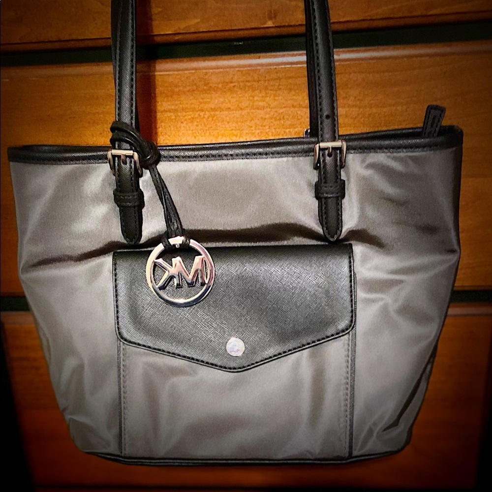 Grey/silver Michael Kors bag.